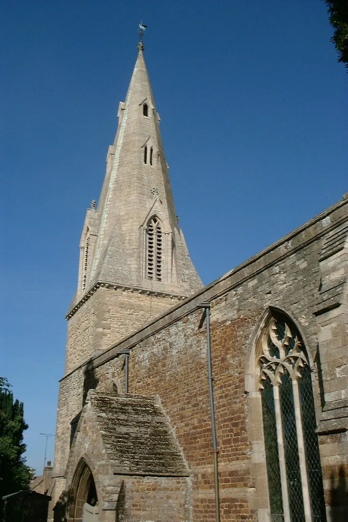 Wes tower and spire of the parish church of the Nativity of Blesséd Virgin Mary, Ringstead, Northamptonshire, seen from the southeast
