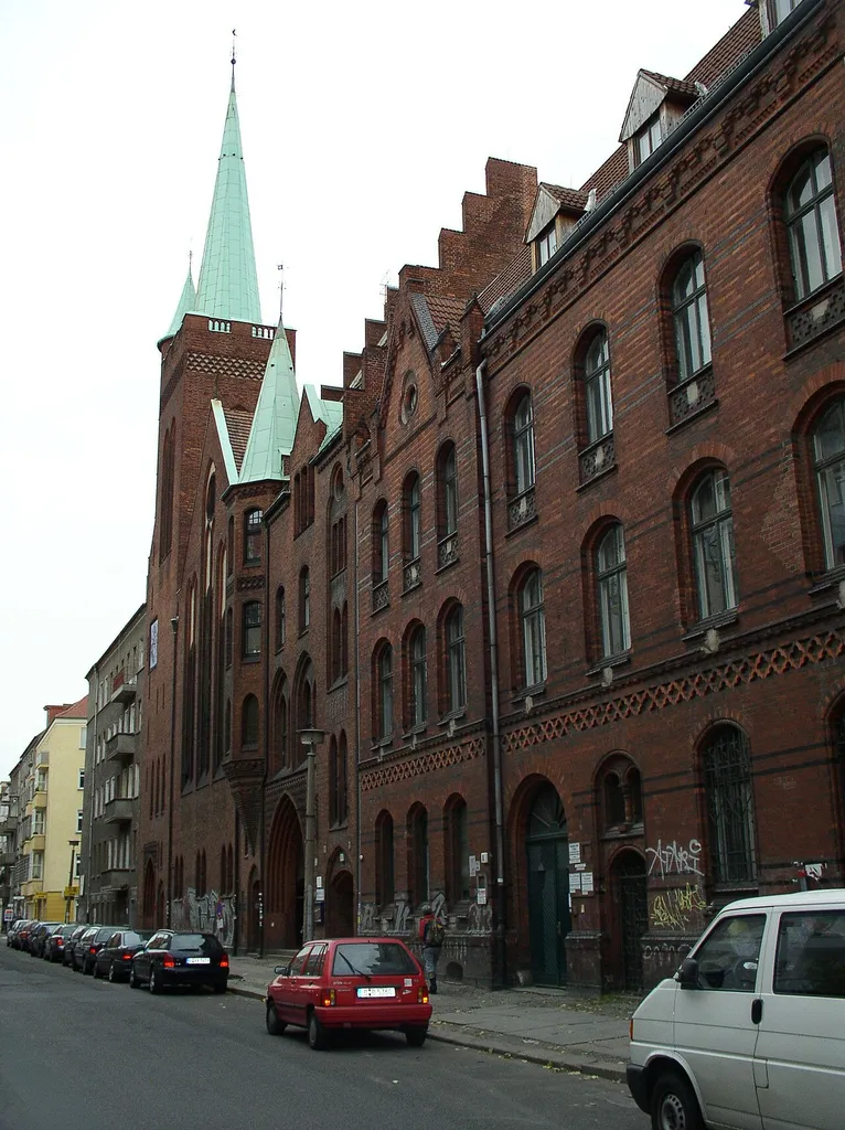 Galilee Church and on its right the former Liebig High School in Rigaer Straße, Friedrichshain, Berlin.