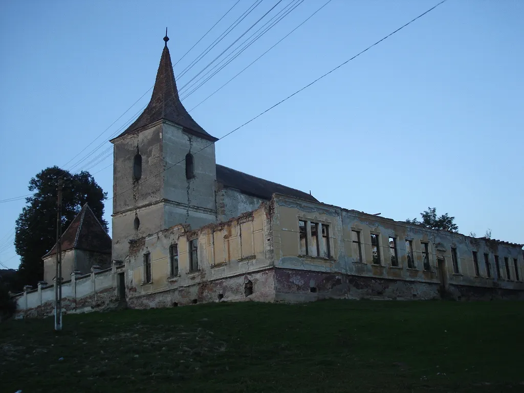 The Saxon church in Felmer (Transylvania, Romania) and the ruins of the former Saxon school