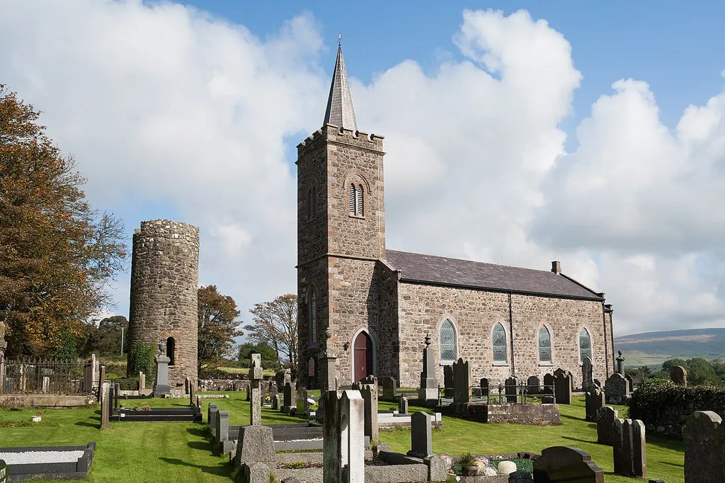 Surviving remains of the round tower and modern church at Armoy in the townland Glebe. This is recorded as a scheduled monument SMR Number ANT 013:010.
