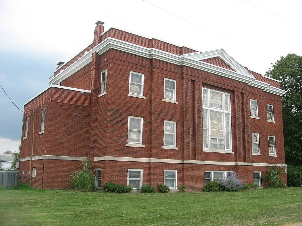 Southern side of the Westervelt Christian Church, located on the northwestern corner of the junction of Main and Chestnut Streets in Westervelt, Illinois, United States. Built in 1921, it is listed on the National Register of Historic Places.