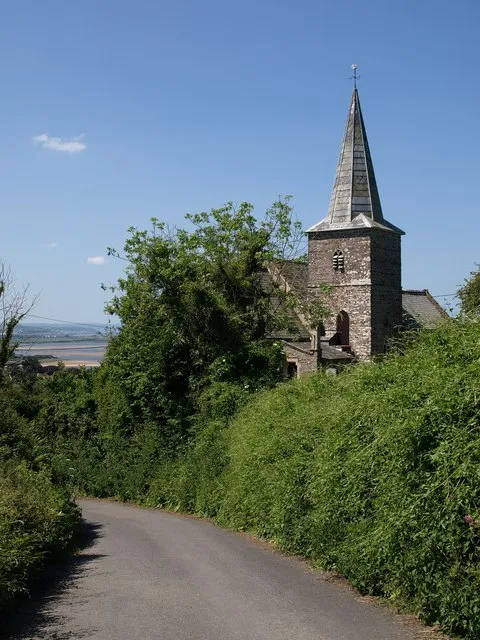 St Peter's church, Ashford, Devon, seen from the east from Adder Lane. An inscription says the northeast tower was built in 1798. The remainder of the church was rebuilt in 1854.
