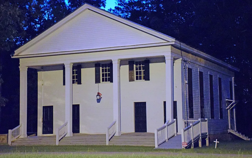 Richland Baptist Church, Twiggs County, Georgia, US. Taken at night when lit by a streetlight, so the color is off.