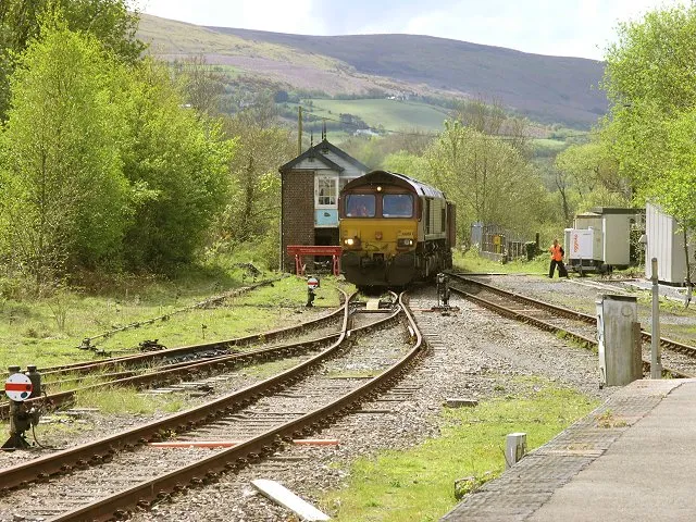Coal train joins the Amman Valley railway branch After many years of being mothballed, the Amman Valley branch line is currently seeing new life with up to three coal trains a week running up and down to service the open cast mine near Gwaun-Cae-Guerwen. Here we see the train just leaving the Heart of Wales Line next to the Pantyffynnon signal box, which controls the entire length of the Heart of Wales line to Craven Arms and also allows a single train to access the Amman Valley Branch at any time.