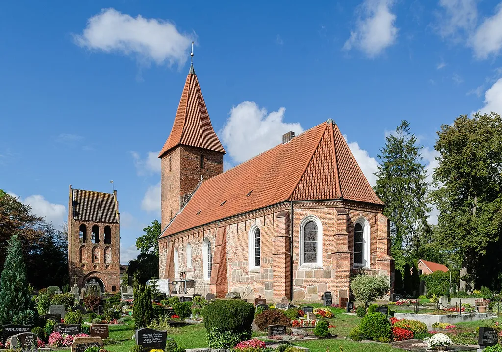 Rastede (Lower Saxony, Germany) – Lutheran Saint Ulrich's Church with bell tower – view from the southeast