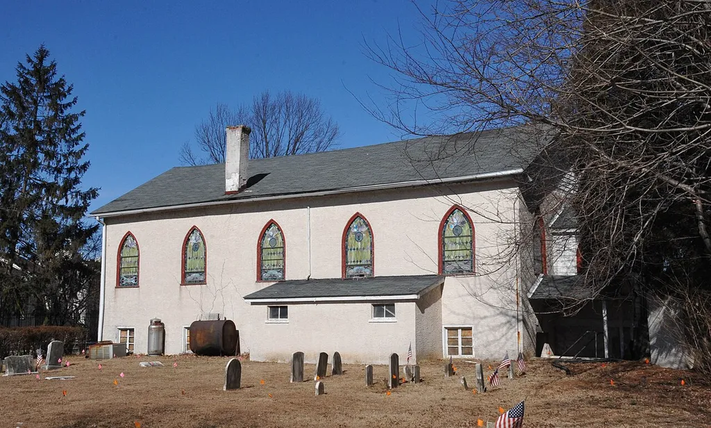 CHURCH CORNERSTONE WAS LAID IN 1861 BUT WORK WAS INTERRUPTED BY THE CIVIL WAR