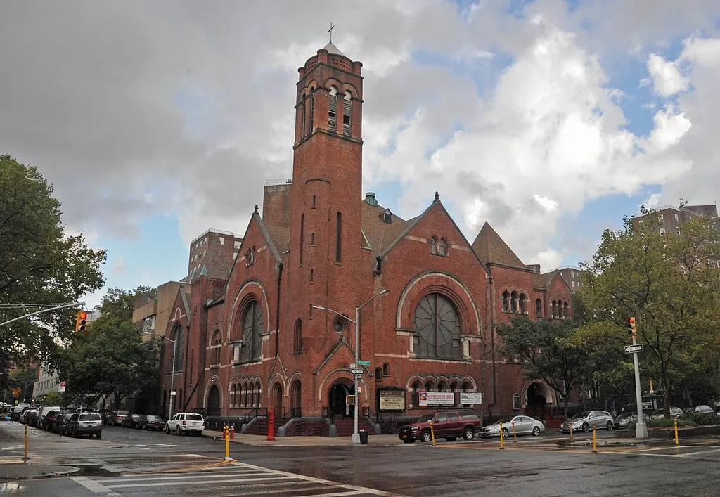 ELABORATE ROMANESQUE JOHN ROCHESTER THOMAS CHURCH WAS LARGEST IN CITY UPON 1887 CONSTRUCTION; LATER EXPANDED AND SOLD TO BLACK CONGREGATION WHICH RENAMED IT SALEM UNITED METHODIST CHURCH.