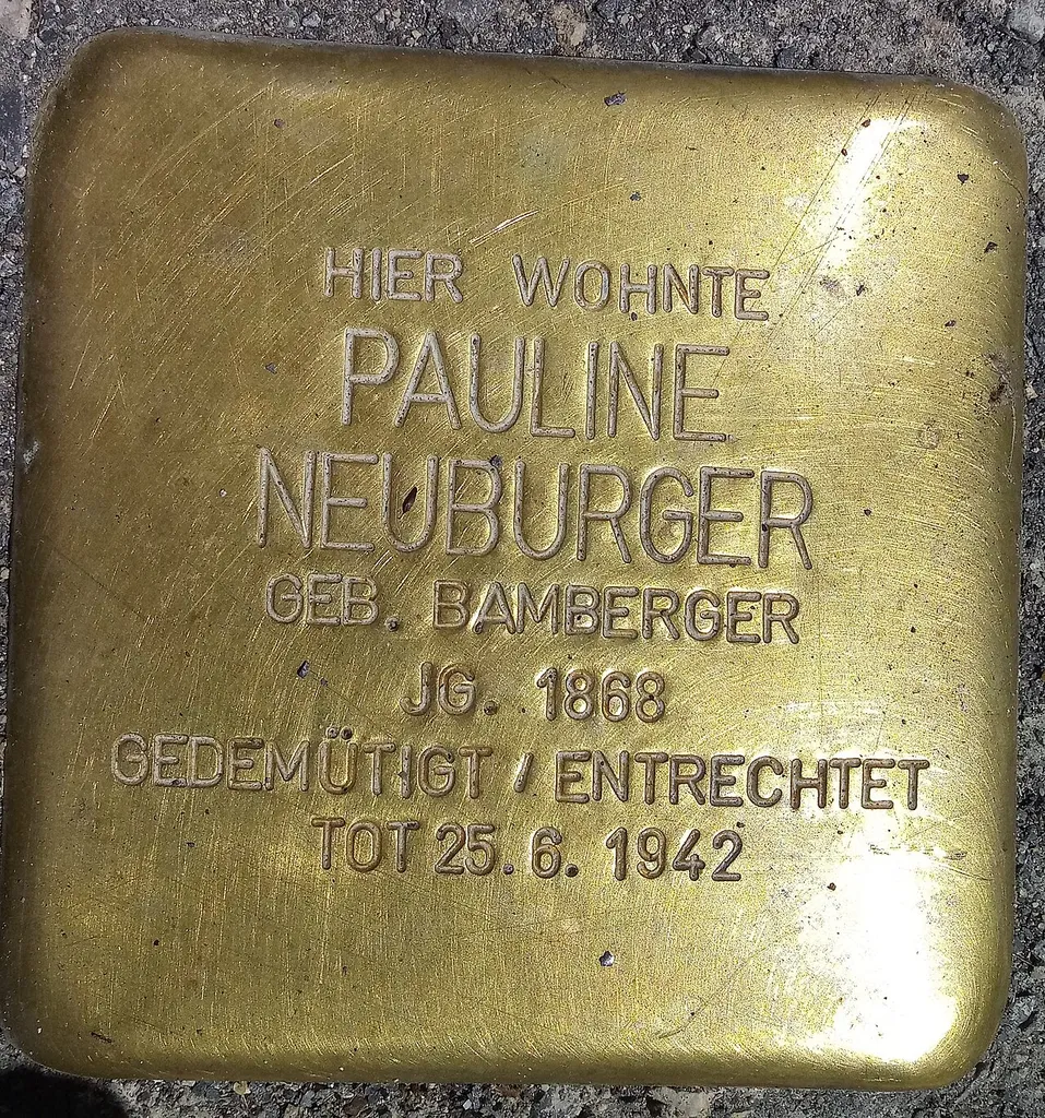 Stumbling stone for Pauline Neuburger at Dachauer Straße 46, Munich. Stumbling stones commemorate the victims of the Nazi regime.