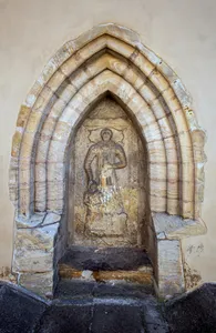 Tombstone in the northern portal of the Church of the Beheading of Saint John the Baptist (Hostivař)