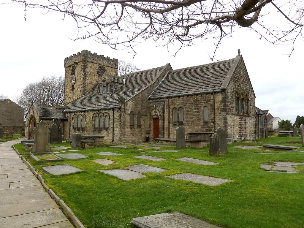 St Peter's Church, w:Hartshead, Kirklees, West Yorkshire, England. It has a 12th century chancel arch, south door and west tower. The rest is the result of heavy renovation in Neo Gothic and Arts and Crafts style by William Swinden Barber in 1881. There is further information about the church here.