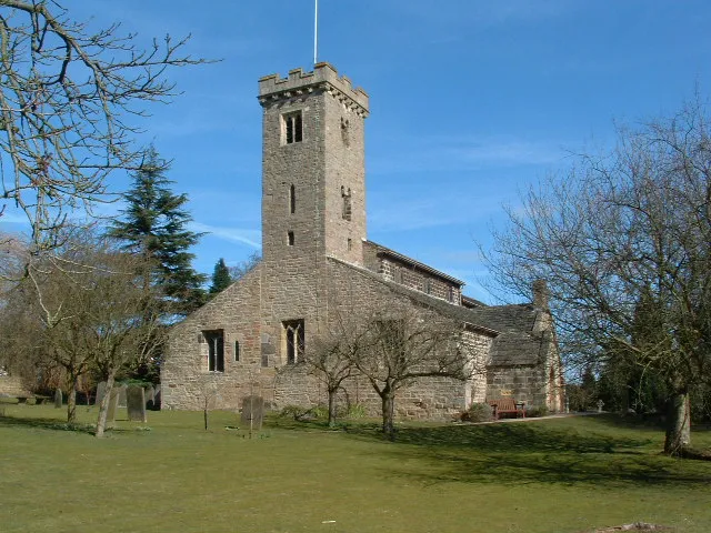 All Hallows parish church, Bardsey, West Yorkshire, seen from the southwest.Most of the tower is Saxon: the lower stages 9th or 10th century and the upper stage later 10th century. The embattled parapet was added early in the 20th century.