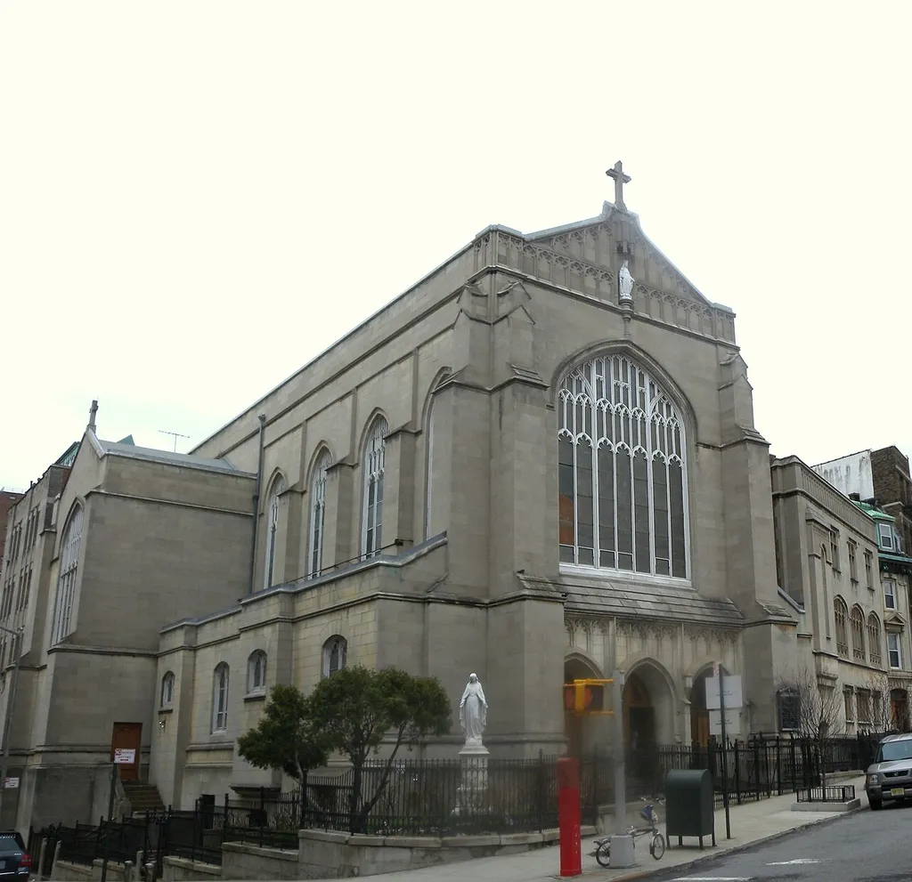 Looking northwest across Convent Avenue at Church of the Annunication on a cloudy day. Location in EXIF came from camera's GPS, uncorrected before upload and not read by conversion bot.