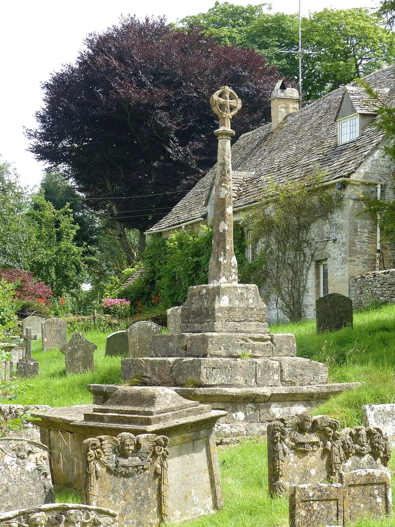 Grade II listed building in North Cerney, Gloucestershire. Listed as "Cross and cross shaft base in the churchyard of the Church of All Saints, circa 9 metres south of the south porch". .mw-parser-output .messagebox{margin:4px 0;width:auto;border-collapse:collapse;border:2px solid var(--border-color-progressive,#6485d1);background-color:var(--background-color-neutral-subtle,#fbfcff);color:var(--color-base,#202122);box-sizing:border-box;border-inline-start-width:8px}.mw-parser-output .messagebox.mbox-small{font-size:88%;line-height:1.25em}.mw-parser-output .mbox-warning,.mw-parser-output .mbox-speedy{border:2px solid var(--border-color-error,#b22222);background:var(--background-color-error-subtle,#ffdbdb);border-inline-start-width:8px}.mw-parser-output .mbox-serious,.mw-parser-output .mbox-delete,.mw-parser-output .mbox-stop{border:2px solid var(--border-color-error,#b22222);border-inline-start-width:8px}.mw-parser-output .mbox-issue,.mw-parser-output .mbox-content{border:2px solid #f28500;background:var(--background-color-warning-subtle,#ffe);border-inline-start-width:8px}.mw-parser-output .mbox-query,.mw-parser-output .mbox-style{border:2px solid #f4c430;background:var(--background-color-warning-subtle,#ffe);border-inline-start-width:8px}.mw-parser-output .mbox-shit{border:2px solid #960;border-inline-start-width:8px}.mw-parser-output .mbox-license{border:2px solid #88a;border-inline-start-width:initial}.mw-parser-output .mbox-legal{border:2px solid var(--border-color-notice,#666);background:var(--background-color-base,#fff);border-inline-start-width:8px}.mw-parser-output .mbox-honor{border:2px solid #ca3;background:var(--background-color-warning-subtle,#fcf4db);border-inline-start-width:8px}.mw-parser-output .mbox-growth{border:2px solid #8d4;background:var(--background-color-success-subtle,#d5fdf4);border-inline-start-width:8px}.mw-parser-output .mbox-move{border:2px solid #93c;border-inline-start-width:8px}.mw-parser-output .mbox-protection,.mw-parser-output .mb