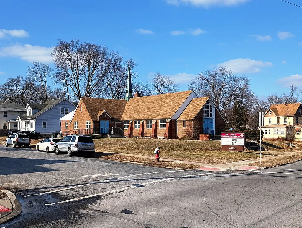 Photo of St. Luke Evangelical Lutheran Church in Dunellen, New Jersey. Photo taken from County Route 665 (New Market Road) at CR 678 (Walnut Street) looking west-northwest.