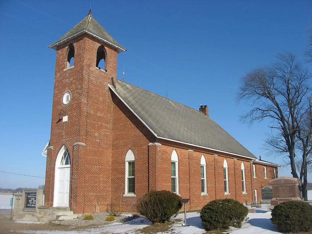 Front and southern side of the Brethren in Christ Church, located at 4395 County Road 7 northwest of Garrett in Keyser Township, DeKalb County, Indiana, United States. Built in 1882, it is listed on the National Register of Historic Places.