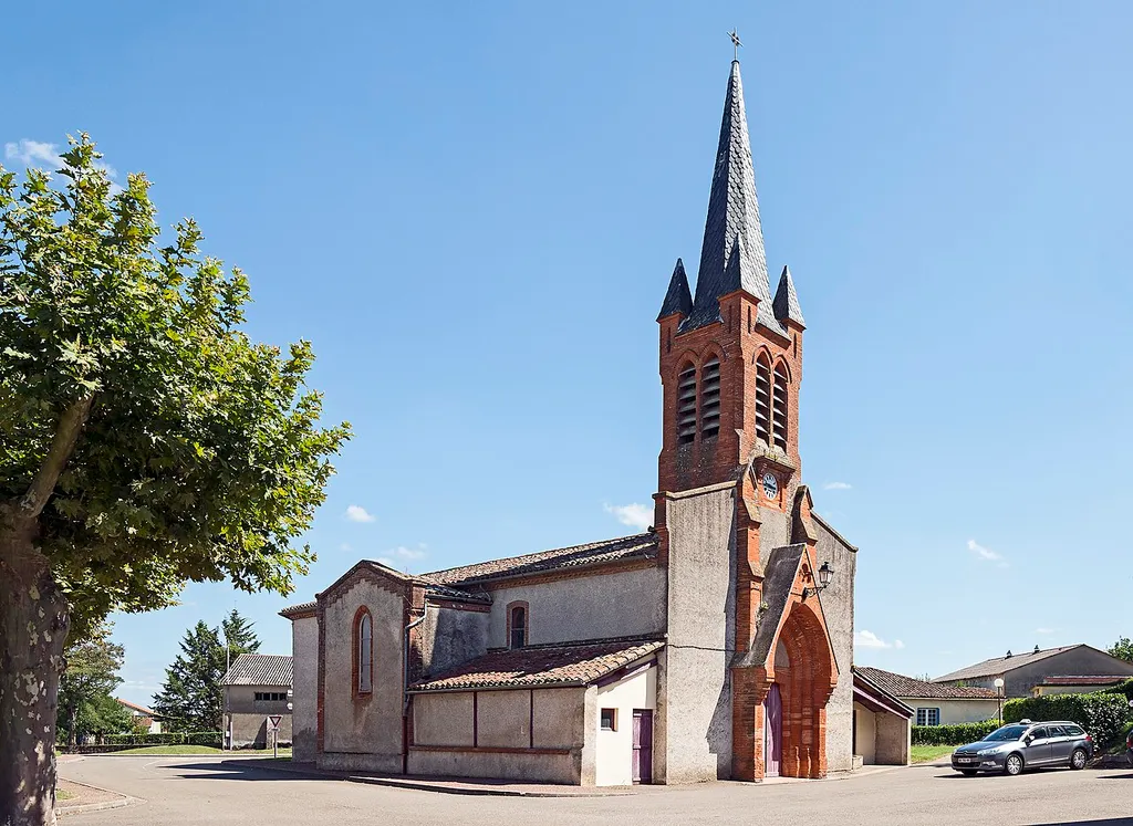 Montbartier (Tarn-et-Garonne). St. Martin Church. View towards Northwest. The bell tower by architect Gabriel Bréfeil.