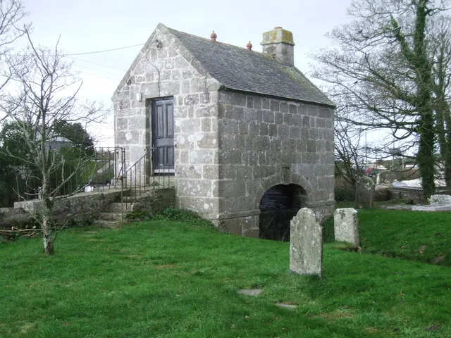 Lych gate, Wendron Church An unusual gate: the steps you see go up to the door,over the wall and down to the lane on the other side; the lych itself is level with the lane and comes through the tunnel you can see in the photo to the churchyard.