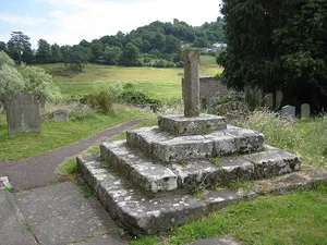 Base of churchyard cross with shaft approximately 2 metres south of south porch of Church of St Giles